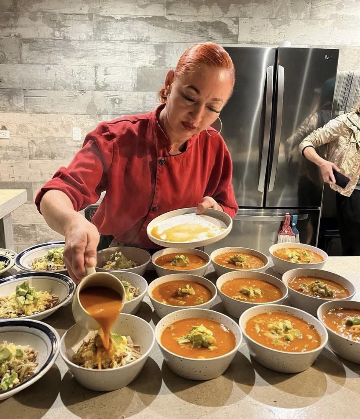Chef Rocío León plating fresh Baja meals at the camp